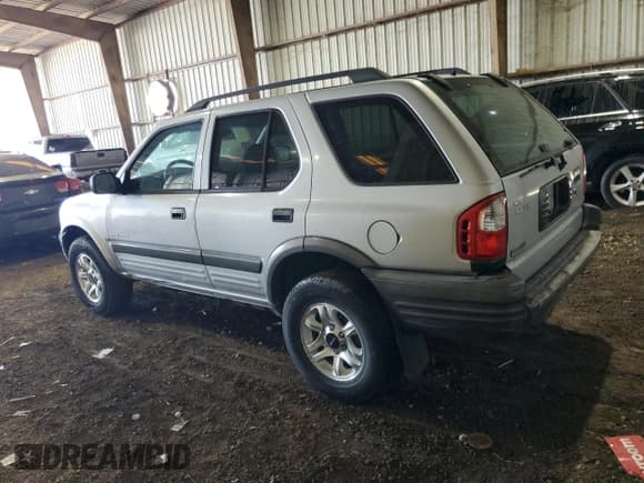 ✅ 2003 Isuzu Rodeo • VIN: 4S2CK58W834304403 • Lot: 86026704. Listed on Copart with 62,011 mi. Free auction sales archive from the USA and detailed vehicle history report at DreamBid. Image 2.