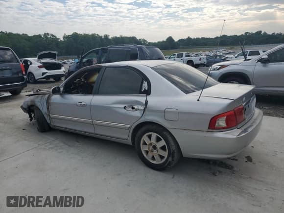 ✅ 2003 Kia Optima LX • VIN: KNAGD128635234756 • Лот: 56122915. Опубликован ранее на Copart с пробегом Не указан. Бесплатный доступ к архиву аукционных продаж из США и подробный отчёт об истории автомобиля на DreamBid. Изображение 2.