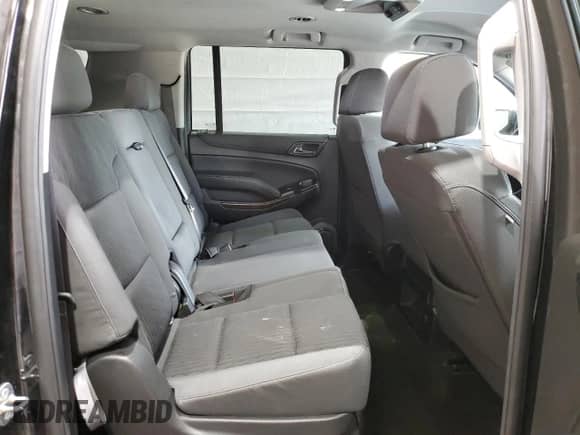 2018 Chevrolet Suburban LS z VIN 1GNSKGEC9JR393340, wystawiony jako Copart lot #56316665 z przebiegiem 104 751 mil mil oraz Szkoda całkowita • Salvage title. Historia ofert i sprzedaży dostępna na DreamBid. Obrazek 11.