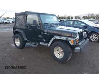 ✅ 1997 Jeep Wrangler SE • VIN: 1J4FY29P7VP542946 • Lot: 43765019. Listed on IAAI with 163,289 mi. Free auction sales archive from the USA and detailed vehicle history report at DreamBid. Image 1.