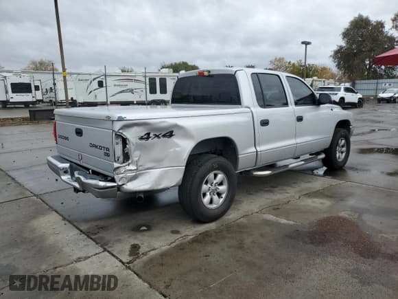 ✅ 2004 Dodge Dakota SLT • VIN: 1D7HG48N34S774345 • Lot: 82226034. Wystawiony na Copart z przebiegiem 177 733 mil. Bezpłatny archiwum sprzedaży aukcyjnych z USA i szczegółowy raport historii pojazdu na DreamBid. Zdjęcie 3.