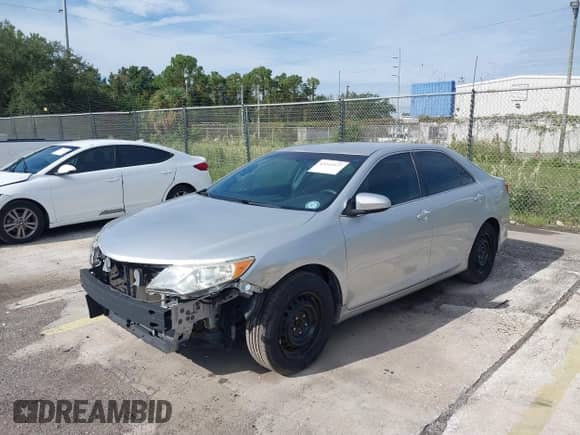 2014 Toyota Camry L with VIN 4T1BF1FK1EU765218, listed as a IAAI auction lot 43211127 with 151,964 mi miles and . Bid and sale history available at DreamBid. Image 2.