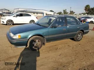 ✅ 1992 Mazda 626 • VIN: 1YVGD22B5N5212605 • Lot: 74945704. Wystawiony na Copart z przebiegiem 99 659 mil. Bezpłatny archiwum sprzedaży aukcyjnych z USA i szczegółowy raport historii pojazdu na DreamBid. Zdjęcie 1.