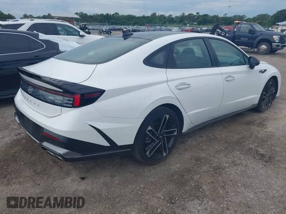 2024 Hyundai Sonata N Line with VIN KMHL54JC2RA418643, listed as a IAAI auction lot 43173088 with 27,398 mi miles and . Bid and sale history available at DreamBid. Image 4.