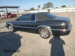 ✅ 2001 Cadillac Eldorado ESC • VIN: 1G6EL12Y21B105623 • Лот: 80270274. Опубликован ранее на Copart с пробегом 100 143 миль. Бесплатный доступ к архиву аукционных продаж из США и подробный отчёт об истории автомобиля на DreamBid. Изображение 2.