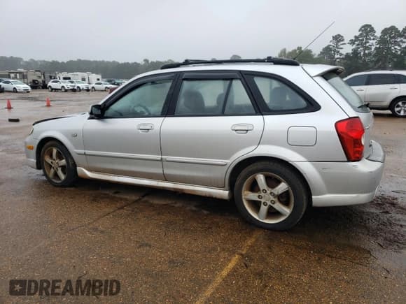 ✅ 2003 Mazda Protege • VIN: JM1BJ246231155356 • Lot: 80207034. Wystawiony na Copart z przebiegiem 81 470 mil. Bezpłatny archiwum sprzedaży aukcyjnych z USA i szczegółowy raport historii pojazdu na DreamBid. Zdjęcie 2.