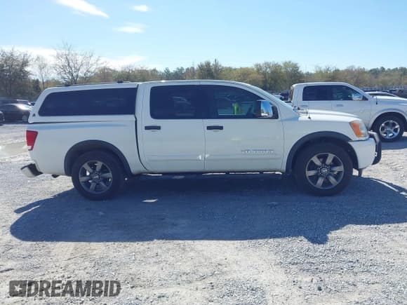 ✅ 2015 Nissan Titan SV • VIN: 1N6BA0ED5FN503033 • Lot: 41881909. Listed on IAAI with 151,432 mi. Free auction sales archive from the USA and detailed vehicle history report at DreamBid. Image 13.
