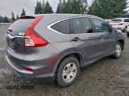 ✅ 2015 Honda CR-V LX • VIN: 2HKRM4H36FH617576 • Lot: 94724275. Listed on Copart with 92,775 mi. Free auction sales archive from the USA and detailed vehicle history report at DreamBid. Image 3.