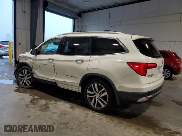 ✅ 2017 Honda Pilot Touring • VIN: 5FNYF5H95HB032358 • Lot: 68666395. Listed on Copart with 67,919 mi. Free auction sales archive from the USA and detailed vehicle history report at DreamBid. Image 2.