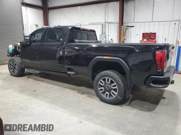 ✅ 2023 GMC Sierra 3500HD AT4 • VIN: 1GT49VEY4PF154771 • Лот: 84748654. Опубликован ранее на Copart с пробегом 75 631 миль. Бесплатный доступ к архиву аукционных продаж из США и подробный отчёт об истории автомобиля на DreamBid. Изображение 2.