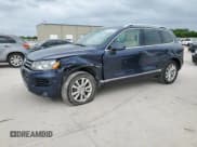 ✅ 2013 Volkswagen Touareg Exec • VIN: WVGEF9BP6DD013915 • Lot: 55024485. Listed on Copart with 238,848 mi. Free auction sales archive from the USA and detailed vehicle history report at DreamBid. Image 1.