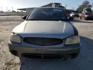2002 Hyundai Accent GS z VIN KMHCG35C72U192411, wystawiony jako Copart lot #85322524 z przebiegiem 130 977 mil mil oraz Szkoda całkowita • Salvage title. Historia ofert i sprzedaży dostępna na DreamBid. Obrazek 5.