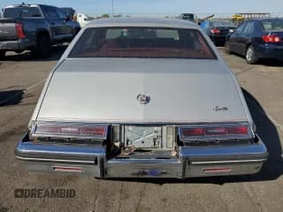 ✅ 1984 Cadillac Seville • VIN: 1G6AS6984EE826325 • Lot: 77209864. Wystawiony na Copart z przebiegiem 26 366 mil. Bezpłatny archiwum sprzedaży aukcyjnych z USA i szczegółowy raport historii pojazdu na DreamBid. Zdjęcie 6.