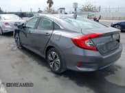 ✅ 2018 Honda Civic EX-T • VIN: JHMFC1F38JX020125 • Lot: 42342438. Listed on IAAI with 115,037 mi. Free auction sales archive from the USA and detailed vehicle history report at DreamBid. Image 3.