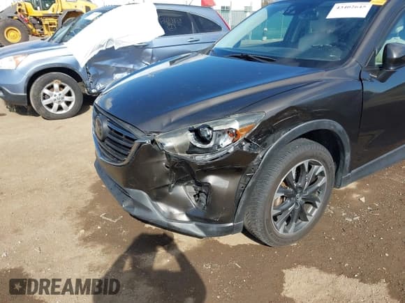 ✅ 2016 Mazda CX-5 Grand Touring • VIN: JM3KE4DY6G0742535 • Lot: 43402645. Wystawiony na IAAI z przebiegiem 130 732 mil. Bezpłatny archiwum sprzedaży aukcyjnych z USA i szczegółowy raport historii pojazdu na DreamBid. Zdjęcie 6.