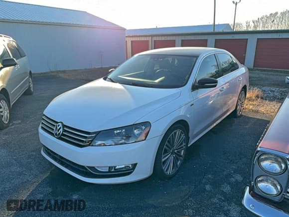 ✅ 2014 Volkswagen Passat SE • VIN: 1VWBS7A34EC113800 • Lot: 95758955. Listed on Copart with 102,669 mi. Free auction sales archive from the USA and detailed vehicle history report at DreamBid. Image 2.