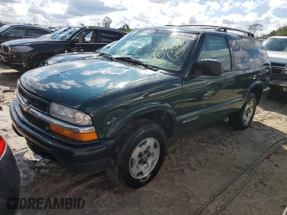 2002 Chevrolet Blazer LS z VIN 1GNCT18W52K187799, wystawiony jako Copart lot #73642634 z przebiegiem Nie podano mil oraz Szkoda całkowita • Salvage title. Historia ofert i sprzedaży dostępna na DreamBid. Obrazek 1.
