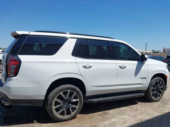 2023 Chevrolet Tahoe RST z VIN 1GNSKRKL7PR524774, wystawiony jako IAAI lot #42086221 z przebiegiem 38 124 mil mil oraz . Historia ofert i sprzedaży dostępna na DreamBid. Obrazek 13.