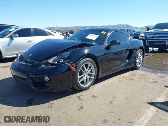 ✅ 2014 Porsche Cayman • VIN: WP0AA2A87EK171793 • Lot: 43450920. Listed on IAAI with 44,921 mi. Free auction sales archive from the USA and detailed vehicle history report at DreamBid. Image 2.