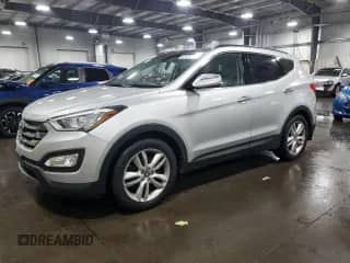2014 Hyundai Santa Fe z VIN 5XYZW3LA4EG205141, wystawiony jako Copart lot #65400145 z przebiegiem 135 224 mil mil oraz Szkoda całkowita • Salvage title. Historia ofert i sprzedaży dostępna na DreamBid. Obrazek 1.