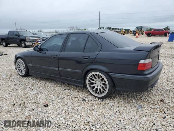 1998 BMW 3 Series M3s with VIN WBSCD9320WEE09027, listed as a Copart auction lot 52202055 with 244,452 mi miles and Clean title. Bid and sale history available at DreamBid. Image 2.