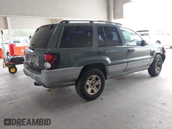 ✅ 2002 Jeep Grand Cherokee Laredo • VIN: 1J4GW48NX2C196495 • Lot: 42781267. Listed on IAAI with 209,655 mi. Free auction sales archive from the USA and detailed vehicle history report at DreamBid. Image 4.