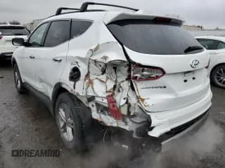 ✅ 2018 Hyundai Santa Fe 2.4L • VIN: 5NMZUDLB4JH076144 • Лот: 73721222. Опубликован ранее на Copart с пробегом 41 793 миль. Бесплатный доступ к архиву аукционных продаж из США и подробный отчёт об истории автомобиля на DreamBid. Изображение 2.