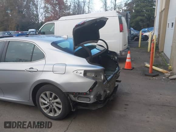 2022 Toyota Camry LE with VIN 4T1R11BKXNU066513, listed as a IAAI auction lot 41324509 with 19,488 mi miles and . Bid and sale history available at DreamBid. Image 16.