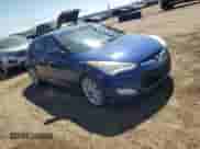 2015 Hyundai Veloster z VIN KMHTC6AD0FU241885, wystawiony jako Copart lot #70447094 z przebiegiem 175 075 mil mil oraz Szkoda całkowita • Salvage title. Historia ofert i sprzedaży dostępna na DreamBid. Obrazek 4.