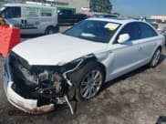 ✅ 2015 Audi A8 • VIN: WAUJGAFD7FN010923 • Lot: 42685997. Listed on IAAI with 154,220 mi. Free auction sales archive from the USA and detailed vehicle history report at DreamBid. Image 2.