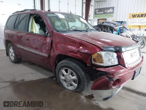 ✅ 2005 GMC Envoy SLE • VIN: 1GKDT13S652352253 • Lot: 42236521. Listed on IAAI with 96,290 mi. Free auction sales archive from the USA and detailed vehicle history report at DreamBid. Image 1.