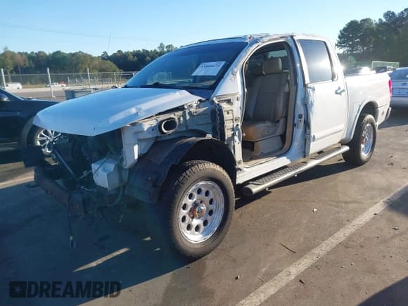 ✅ 2009 Nissan Titan LE • VIN: 1N6BA07D79N318614 • Lot: 43460475. Listed on IAAI with 232,157 mi. Free auction sales archive from the USA and detailed vehicle history report at DreamBid. Image 2.