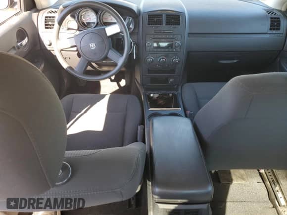 2009 Dodge Charger Police z VIN 2B3KA43T79H572065, wystawiony jako Copart lot #67554764 z przebiegiem 119 259 mil mil oraz Czysty tytuł • Clean title. Historia ofert i sprzedaży dostępna na DreamBid. Obrazek 8.