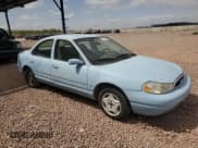 ✅ 1998 Ford Contour LX • VIN: 1FAFP66LXWK197384 • Lot: 51519385. Listed on Copart with 56,958 mi. Free auction sales archive from the USA and detailed vehicle history report at DreamBid. Image 4.