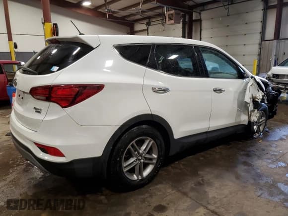 ✅ 2018 Hyundai Santa Fe 2.4L • VIN: 5NMZTDLB3JH094668 • Лот: 65785084. Опубликован ранее на Copart с пробегом 71 472 миль. Бесплатный доступ к архиву аукционных продаж из США и подробный отчёт об истории автомобиля на DreamBid. Изображение 3.