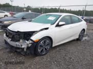 ✅ 2017 Honda Civic EX-T • VIN: 2HGFC1F33HH654766 • Lot: 43381095. Listed on IAAI with 91,261 mi. Free auction sales archive from the USA and detailed vehicle history report at DreamBid. Image 2.