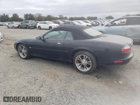 ✅ 2002 Jaguar XK • VIN: SAJDA42C12NA23956 • Лот: 84607195. Опубликован ранее на Copart с пробегом 84 826 миль. Бесплатный доступ к архиву аукционных продаж из США и подробный отчёт об истории автомобиля на DreamBid. Изображение 2.