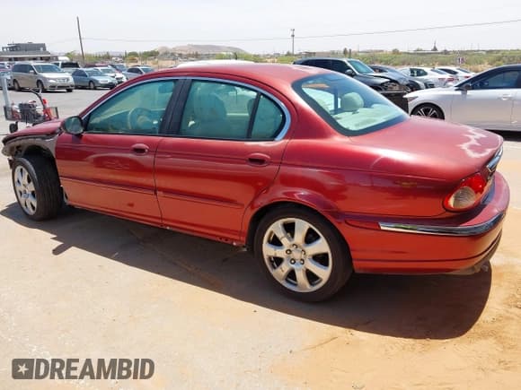 ✅ 2006 Jaguar X-Type • VIN: SAJWA51A86WE85817 • Lot: 42268056. Listed on IAAI with 120,918 mi. Free auction sales archive from the USA and detailed vehicle history report at DreamBid. Image 14.
