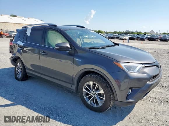 ✅ 2018 Toyota RAV4 Hybrid XLE • VIN: JTMRJREVXJD218017 • Lot: 84900875. Listed on Copart with 87,400 mi. Free auction sales archive from the USA and detailed vehicle history report at DreamBid. Image 4.