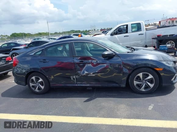✅ 2020 Honda Civic LX • VIN: 2HGFC2F64LH579634 • Lot: 43118354. Listed on IAAI with 72,747 mi. Free auction sales archive from the USA and detailed vehicle history report at DreamBid. Image 14.