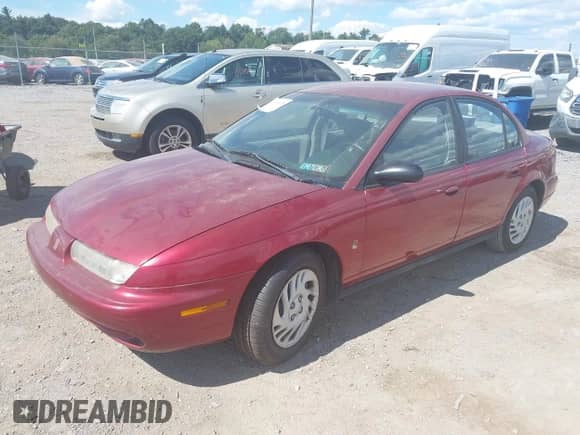 1998 Saturn SL z VIN 1G8ZK5277WZ156690, wystawiony jako IAAI lot #43106078 z przebiegiem 168 196 mil mil oraz . Historia ofert i sprzedaży dostępna na DreamBid. Obrazek 2.