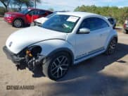 ✅ 2016 Volkswagen Beetle Dune • VIN: 3VWS17AT8GM632868 • Lot: 43810321. Listed on IAAI with 75,311 mi. Free auction sales archive from the USA and detailed vehicle history report at DreamBid. Image 18.