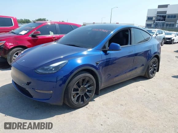 ✅ 2023 Tesla Model Y Long Range • VIN: 7SAYGAEE2PF969953 • Lot: 43163995. Listed on IAAI with 23,353 mi. Free auction sales archive from the USA and detailed vehicle history report at DreamBid. Image 2.