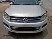 ✅ 2013 Volkswagen Touareg Exec • VIN: WVGEF9BP9DD011432 • Lot: 61800405. Listed on Copart with 187,342 mi. Free auction sales archive from the USA and detailed vehicle history report at DreamBid. Image 12.