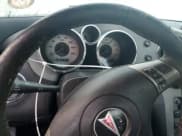 ✅ 2009 Pontiac Solstice • VIN: 1G2MN35B59Y107109 • Лот: 76083734. Опубликован ранее на Copart с пробегом Не указан. Бесплатный доступ к архиву аукционных продаж из США и подробный отчёт об истории автомобиля на DreamBid. Изображение 9.