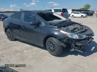 ✅ 2018 Chevrolet Cruze LS • VIN: 1G1BC5SM5J7191011 • Lot: 43385502. Listed on IAAI with 124,918 mi. Free auction sales archive from the USA and detailed vehicle history report at DreamBid. Image 1.