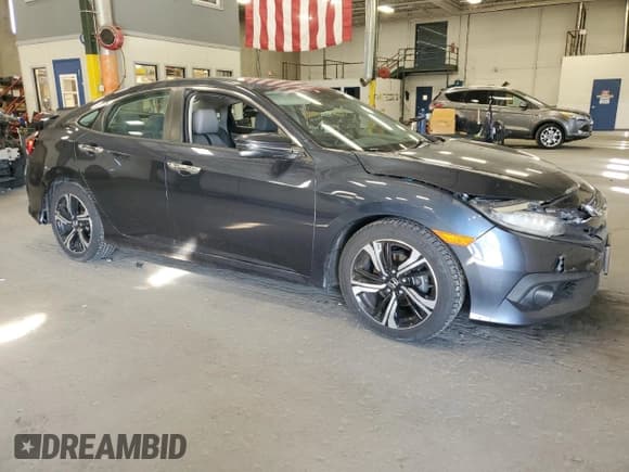 ✅ 2017 Honda Civic Touring • VIN: 19XFC1F90HE016649 • Lot: 85663245. Listed on Copart with 69,941 mi. Free auction sales archive from the USA and detailed vehicle history report at DreamBid. Image 4.
