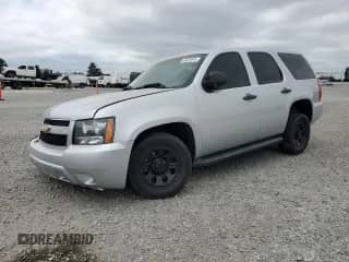 2014 Chevrolet Tahoe Commercial with VIN 1GNLC2E03ER128350, listed as a Copart auction lot 68876045 with 199,729 mi miles and Salvage title. Bid and sale history available at DreamBid. Image 1.