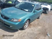 ✅ 2002 Mazda Protege DX • VIN: JM1BJ225120524478 • Lot: 42752160. Listed on IAAI with 193,561 mi. Free auction sales archive from the USA and detailed vehicle history report at DreamBid. Image 2.