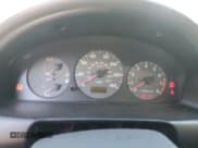 ✅ 1999 Mazda Protege DX • VIN: JM1BJ2222X0126273 • Lot: 75479364. Wystawiony na Copart z przebiegiem 293 952 mil. Bezpłatny archiwum sprzedaży aukcyjnych z USA i szczegółowy raport historii pojazdu na DreamBid. Zdjęcie 9.